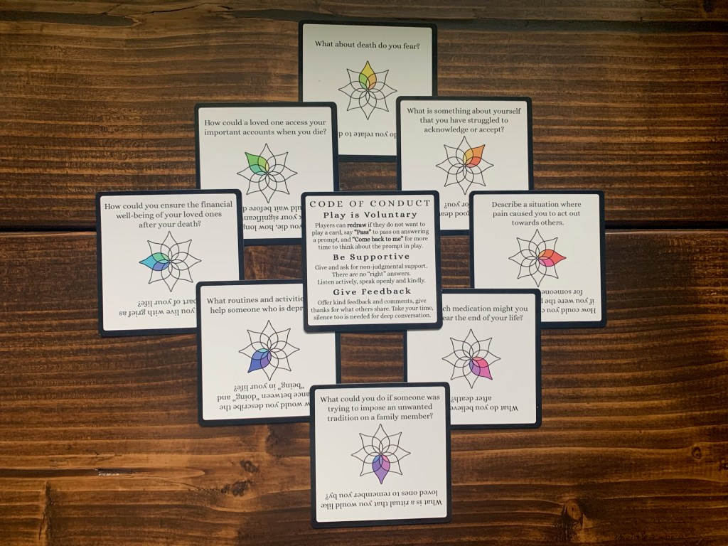 Cards from the Creative Dying Game arranged in a diamond pattern. 